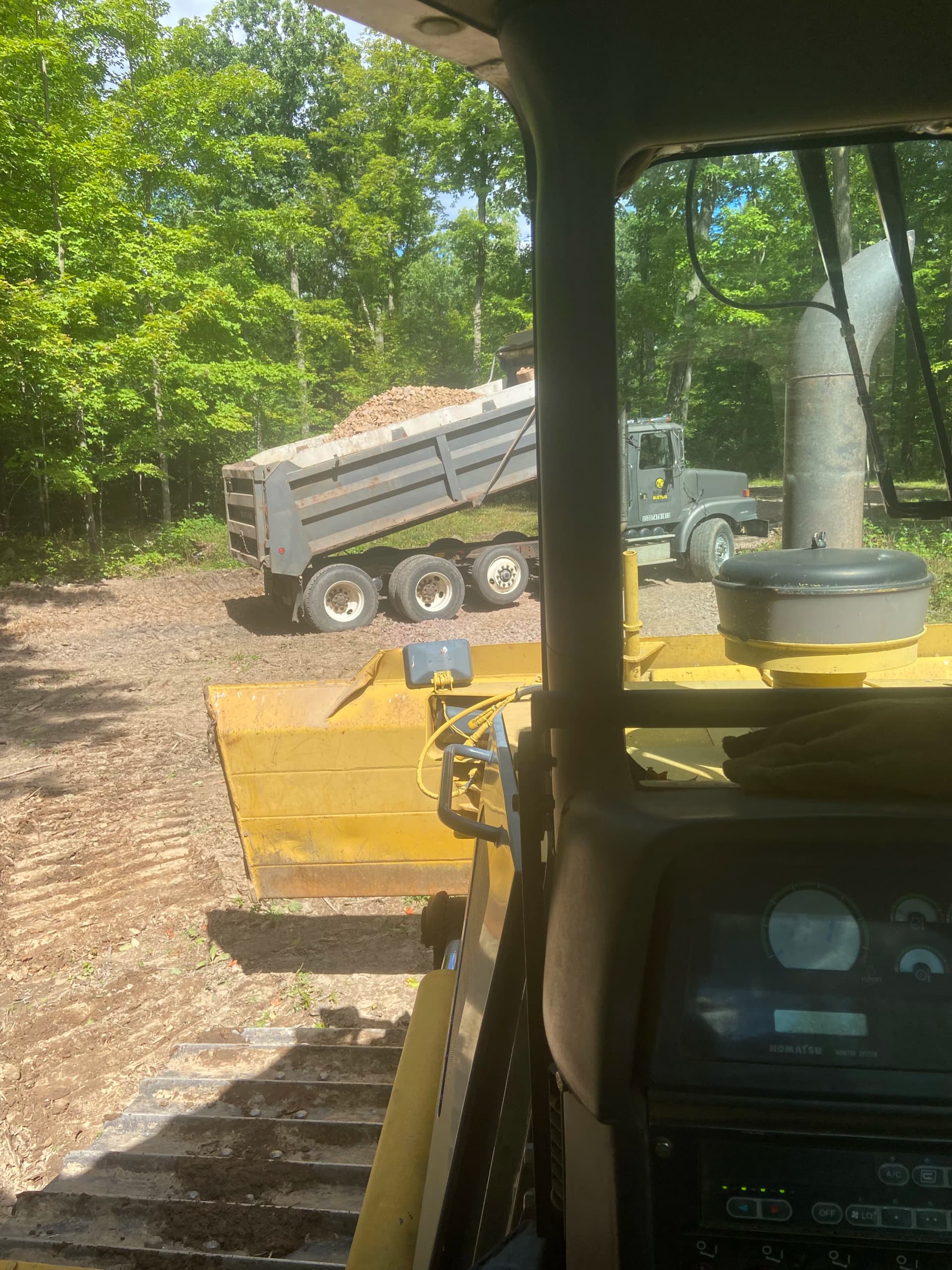 Camper Pad and Driveway Built from Overgrown Wooded Property