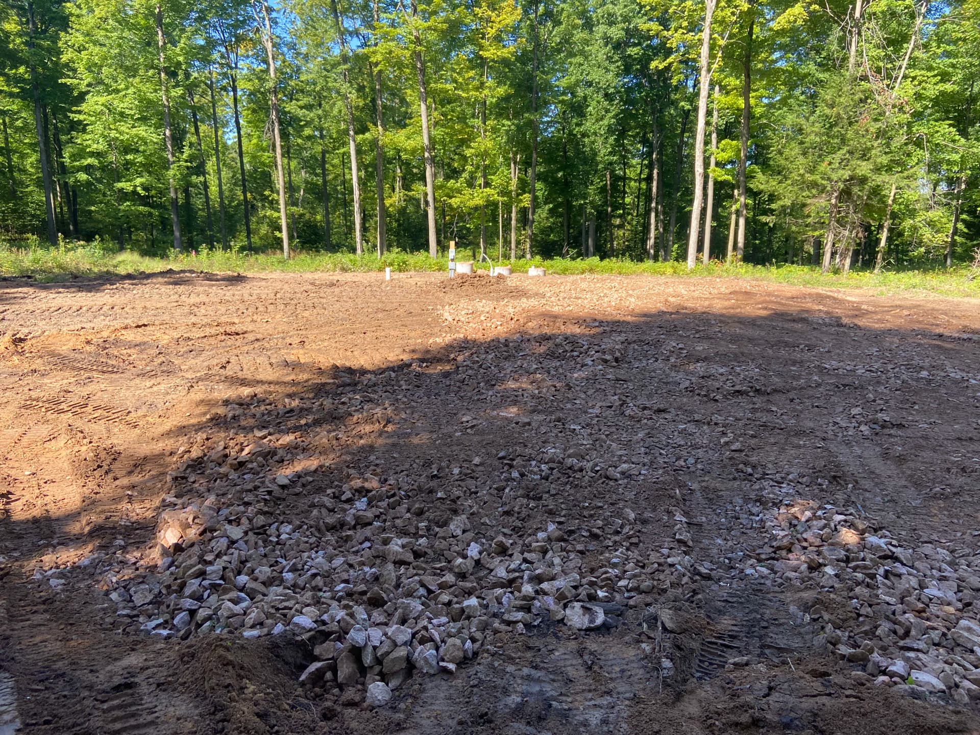 Camper Pad and Driveway Built from Overgrown Wooded Property
